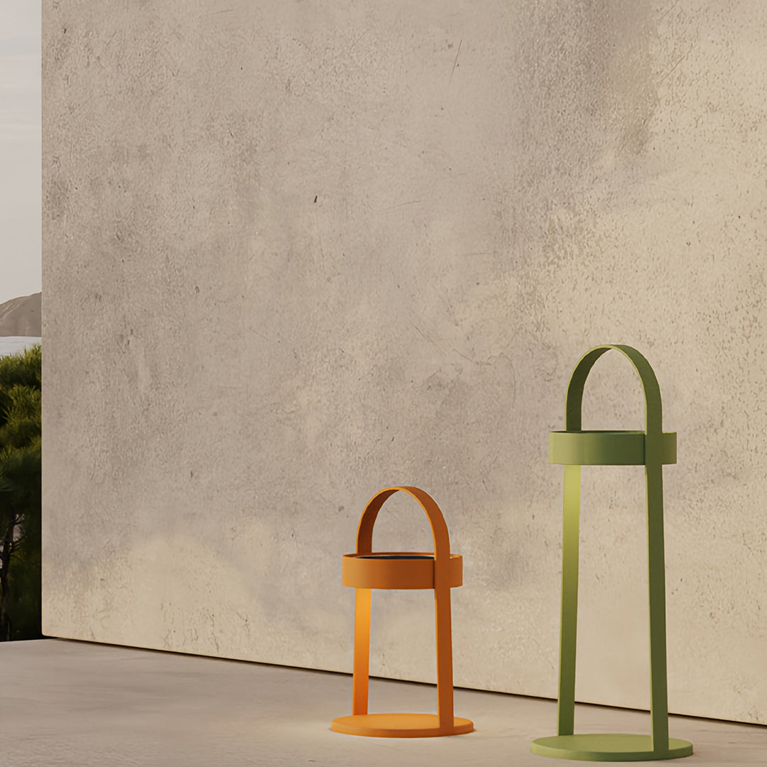 Outdoor landscaping lighting lanterns arranged by wall creating warm decorative scene.