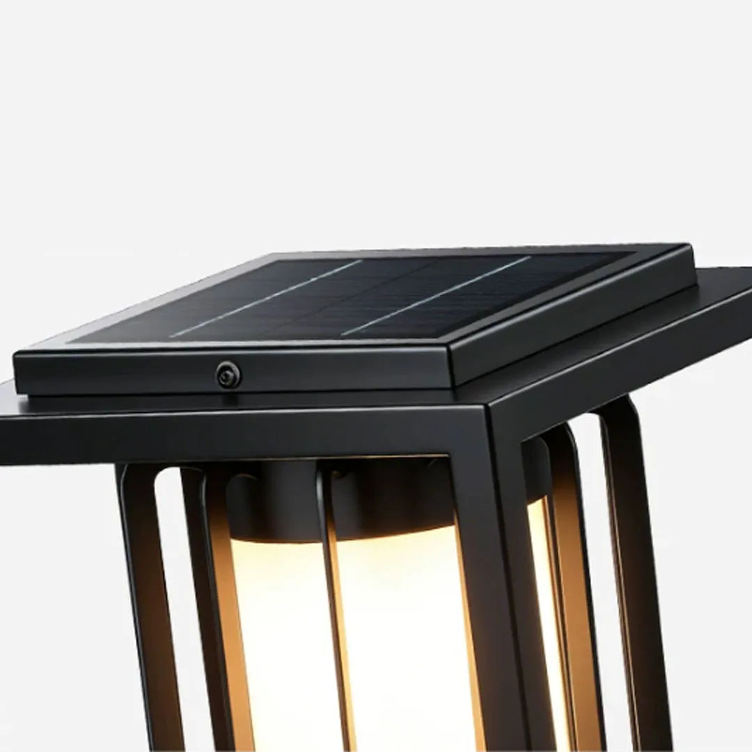 Close-up of the top solar panel on an outdoor lantern light fixture with a black metal housing.
