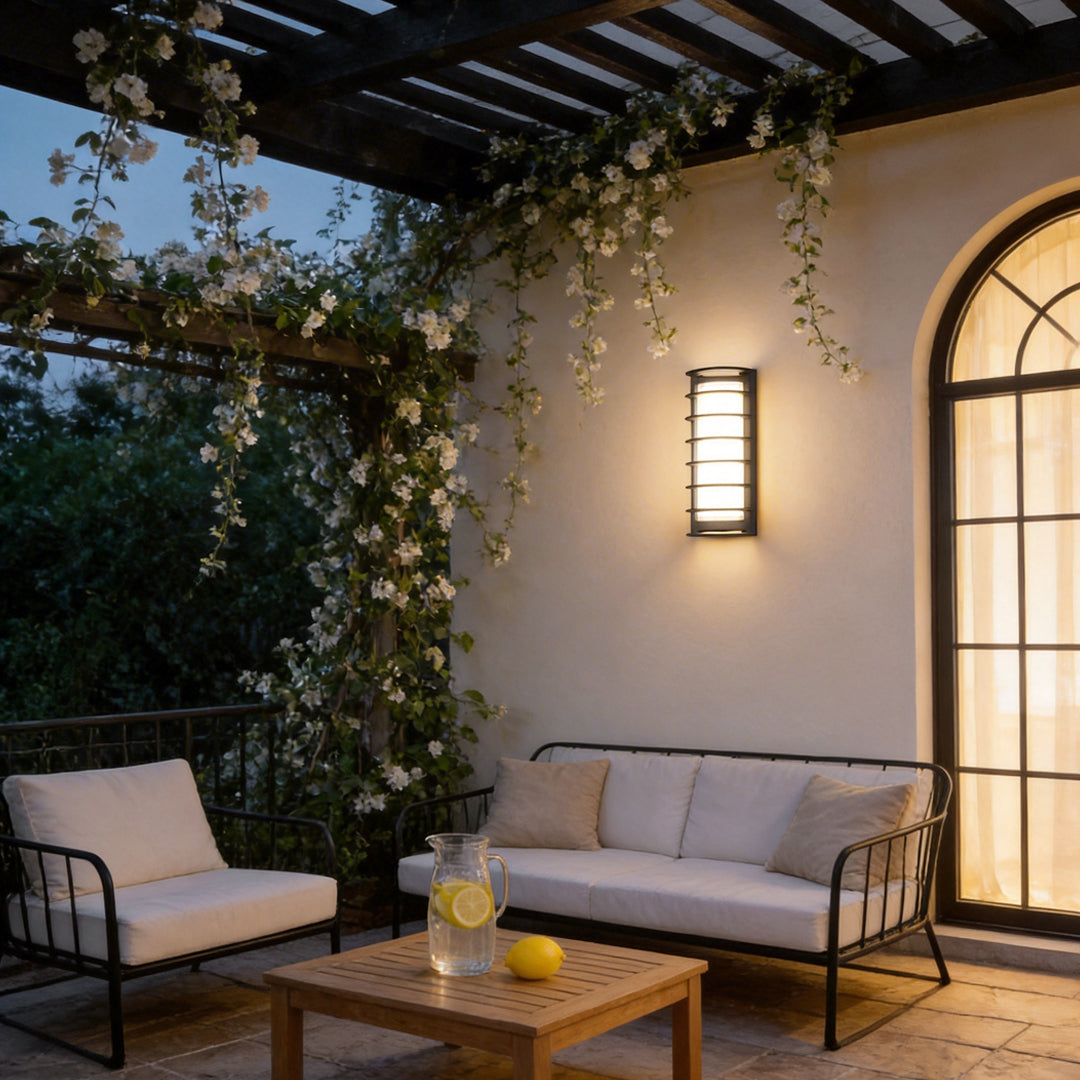 Outdoor LED light fixtures wall mount illuminating a cozy patio with warm glow.