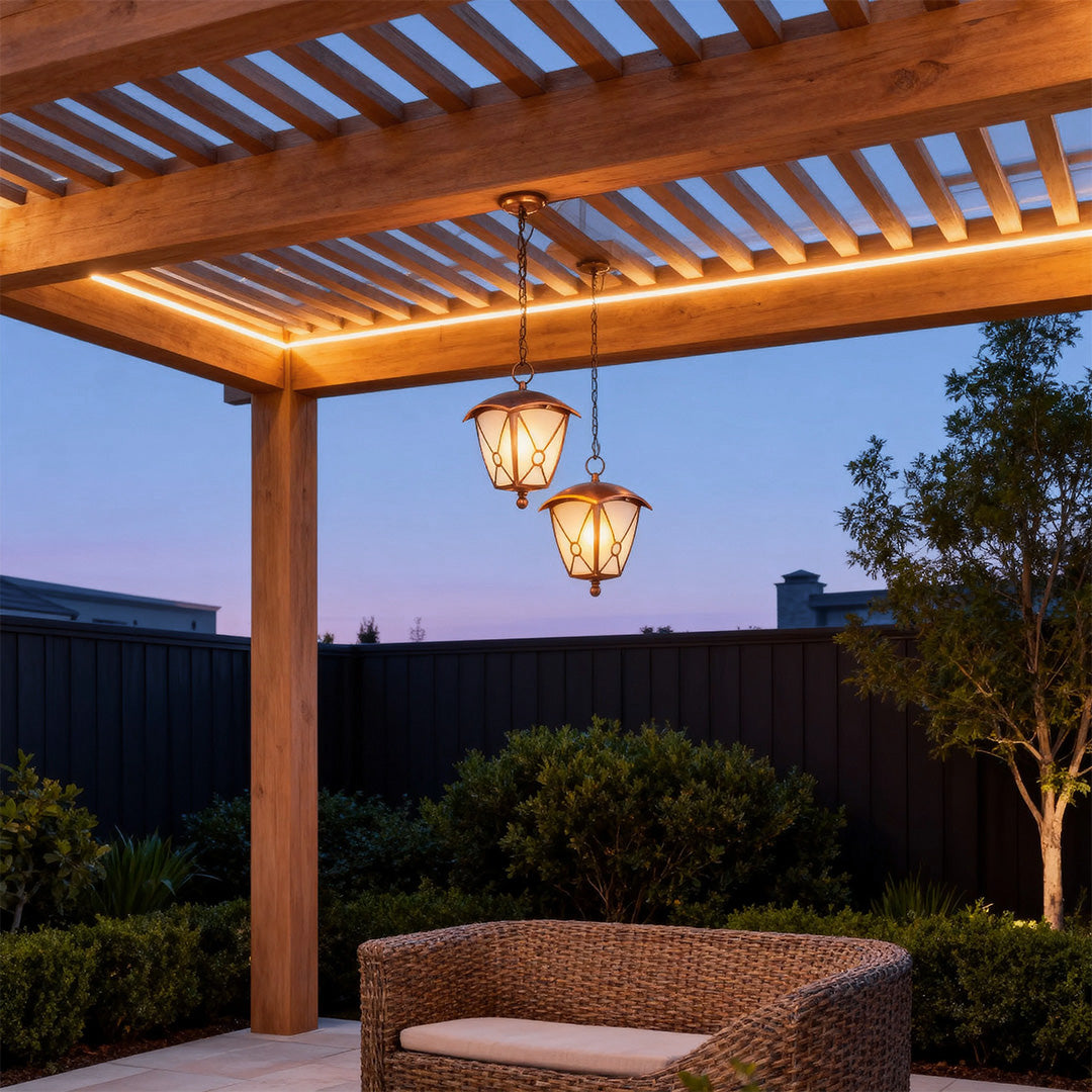 Outdoor LED pendant light hanging from wooden pergola illuminating seating area at dusk with mountain views