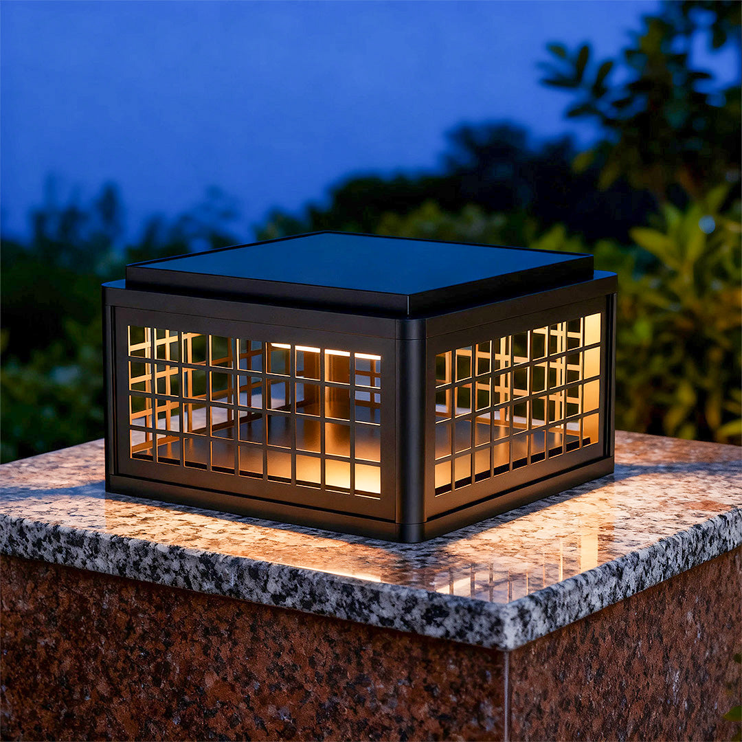 Outdoor LED pillar light installed near a driveway entrance, providing a modern and welcoming glow.