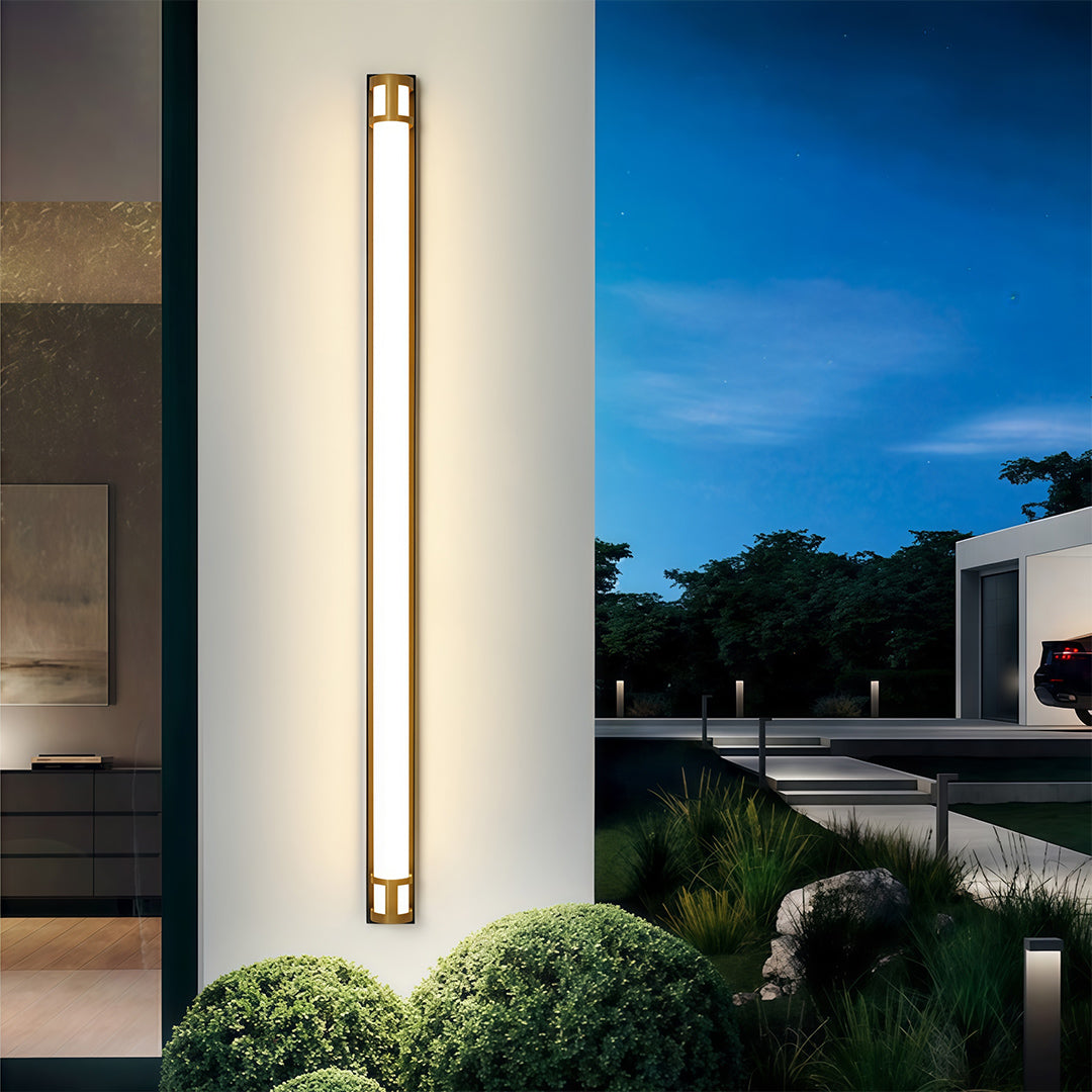 Outdoor led wall sconce lighting illuminating modern walkway and landscaped exterior