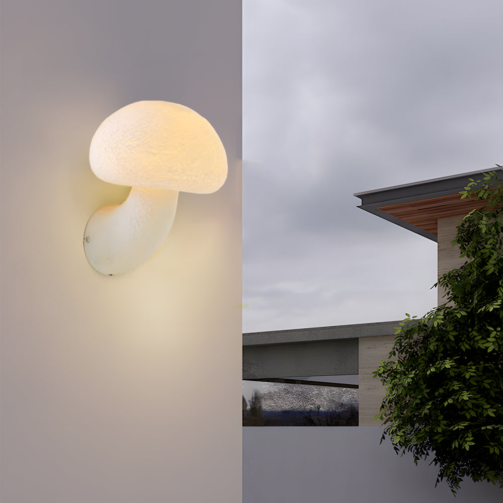Outdoor installation of weather-resistant LED wall lights with modern organic design creating atmospheric exterior lighting