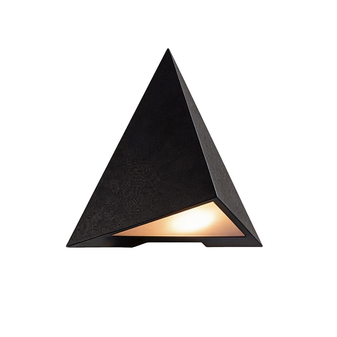 Outdoor LED wall sconce with a modern triangular design, providing ambient lighting.