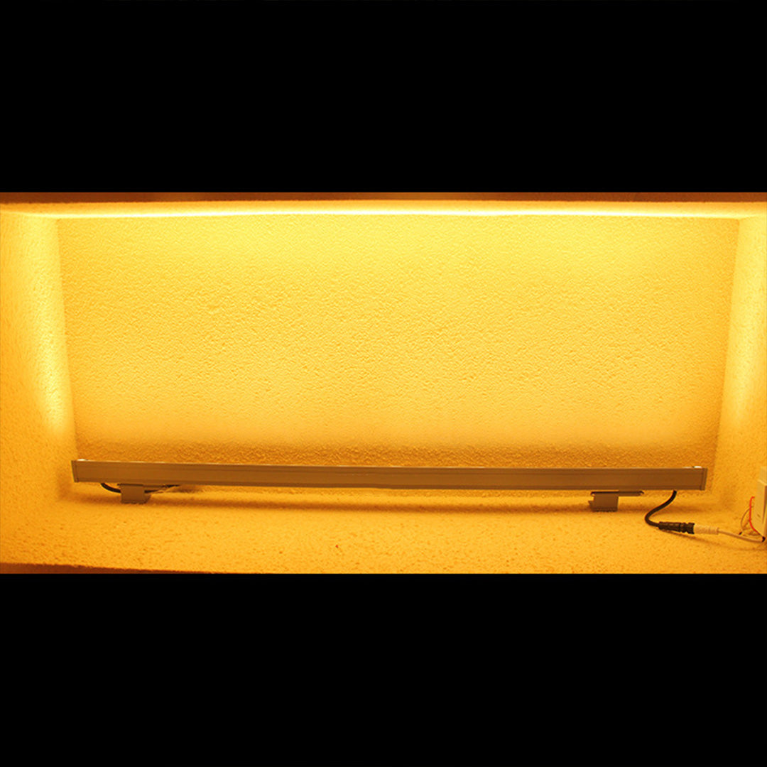 Outdoor LED wall wash lighting demonstration showing warm illumination effect on textured surface