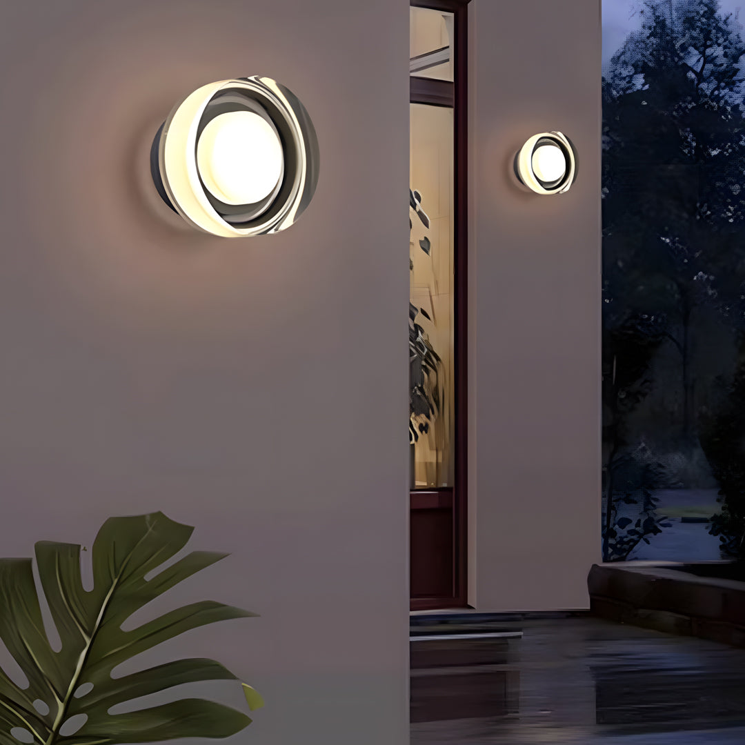 Mounted outdoor light fixtures wall illuminating an exterior entrance at dusk with soft ambient glow.