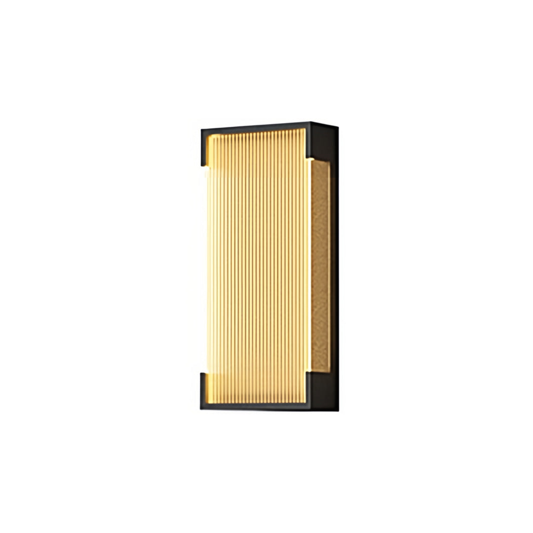 Slim gold outdoor lighting fixtures wall mounted with elongated ribbed glass shade presented against a neutral white setting.