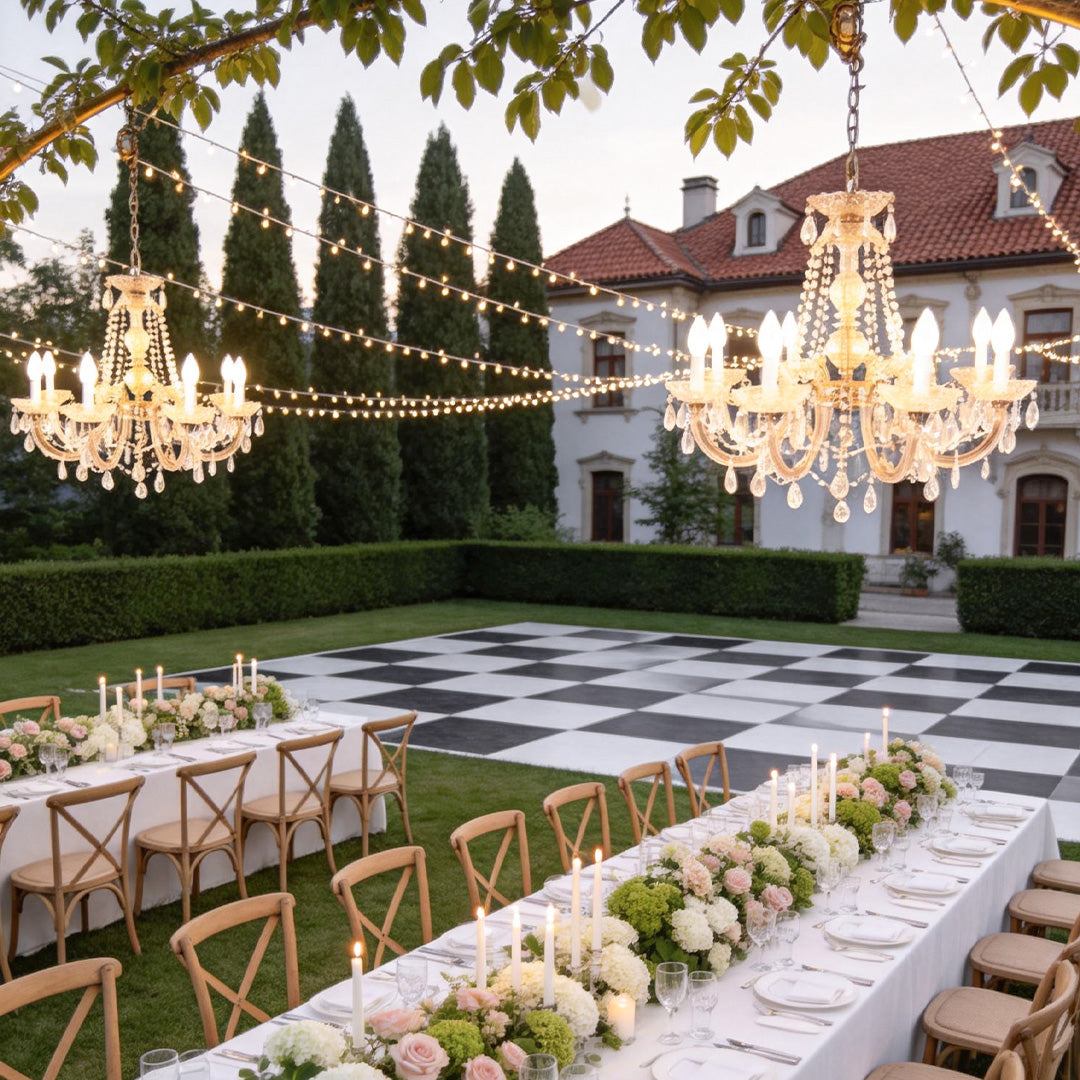 Outdoor lighting hanging with a vintage design, enhancing a garden wedding setup.
