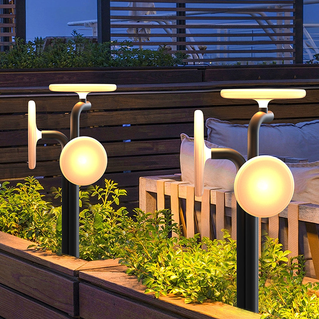 Rendered garden walkway with modern outdoor lighting path lights emitting warm decorative light.