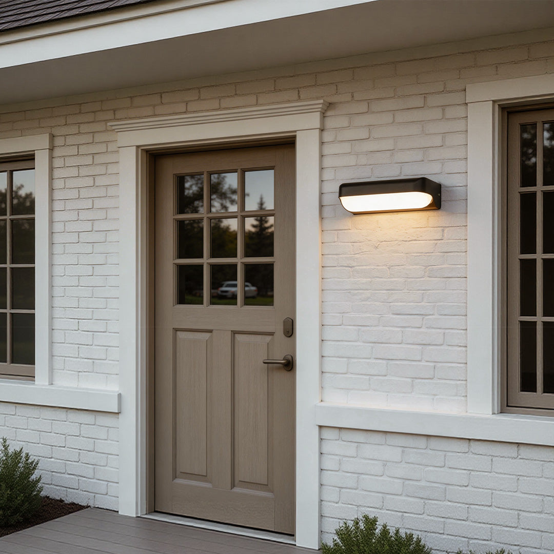 Outdoor lighting wall with a contemporary design, providing warm illumination near a patio.