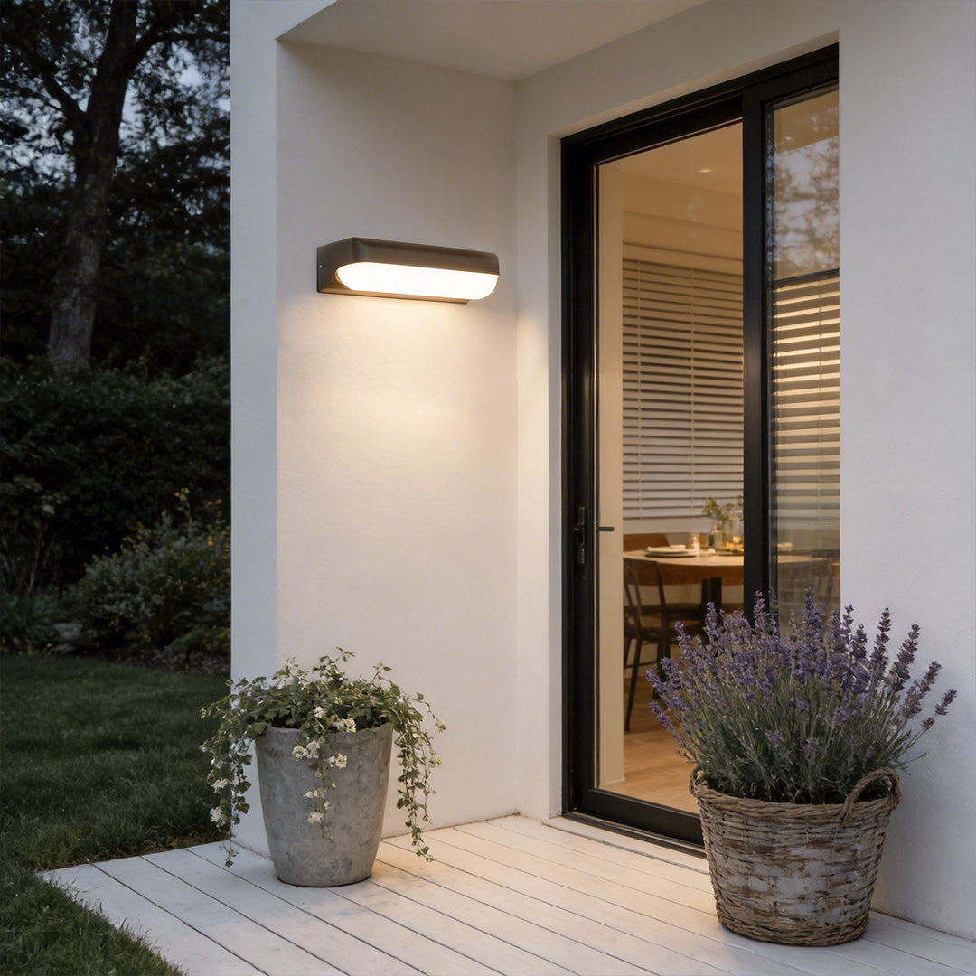 Outdoor lighting wall with a sleek design, enhancing a modern house entrance.