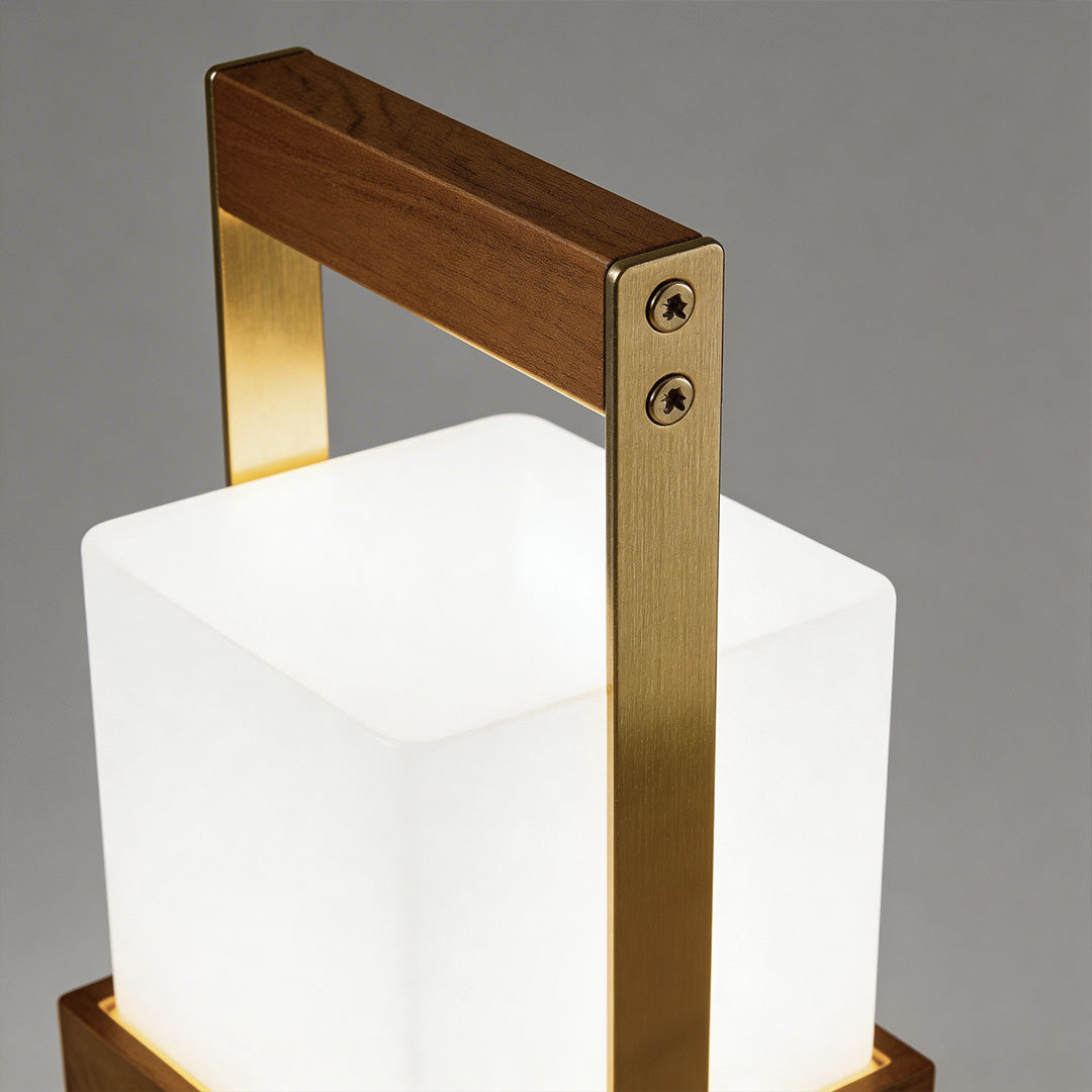 Outdoor lights lanterns with a modern design, placed on a wooden table.