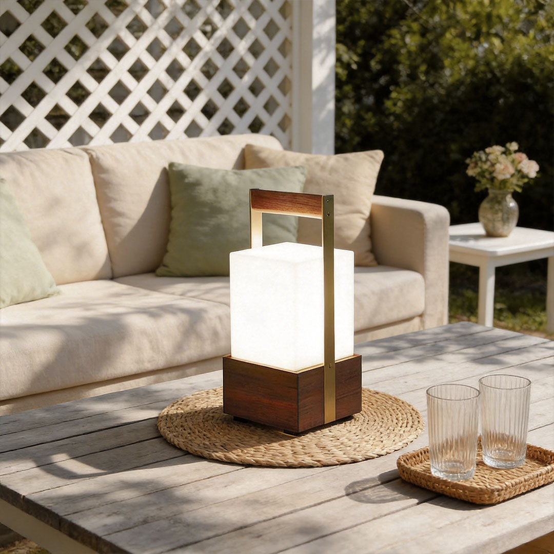 Outdoor lights lanterns with a wooden design, providing warm illumination near a dining table.