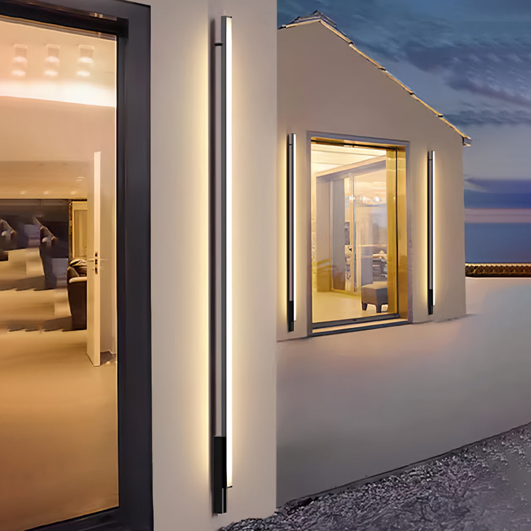 Contemporary outdoor lights wall sconces installed on a modern architectural entrance with soft ambient glow.