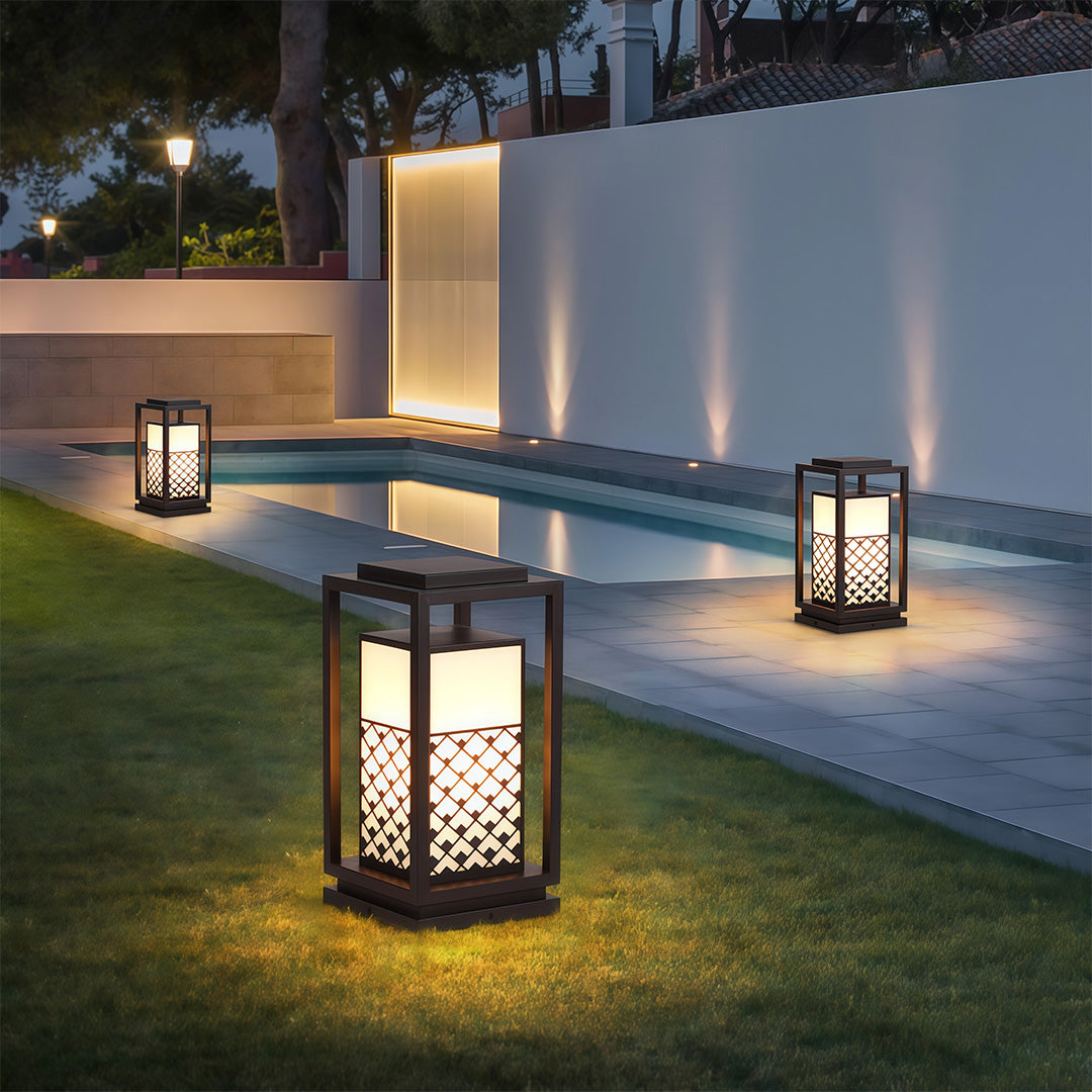 Outdoor bollard light with a sleek, modern design and warm light, ideal for highlighting garden features.