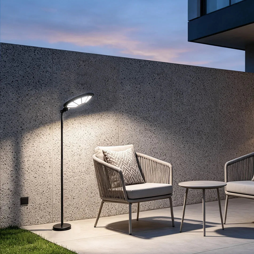 Outdoor modern floor lamps casting bright light across a minimalist terrace seating area.