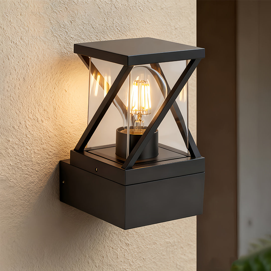 Contemporary outdoor modern wall sconce mounted near an entrance, featuring warm illumination and geometric framing.