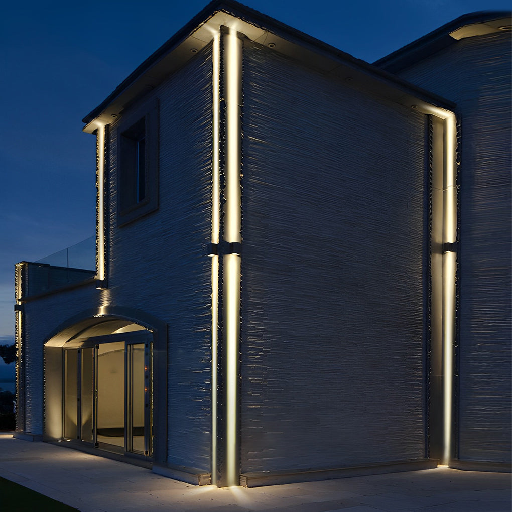 Outdoor narrow beam wall sconce used along pathway walls for subtle architectural accent lighting.