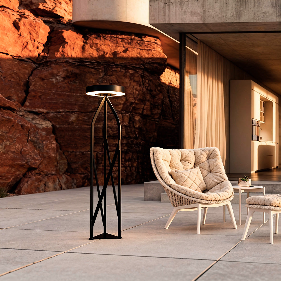 Outdoor patio floor lamps enhancing a modern patio space with comfortable chairs and scenic mountain views.