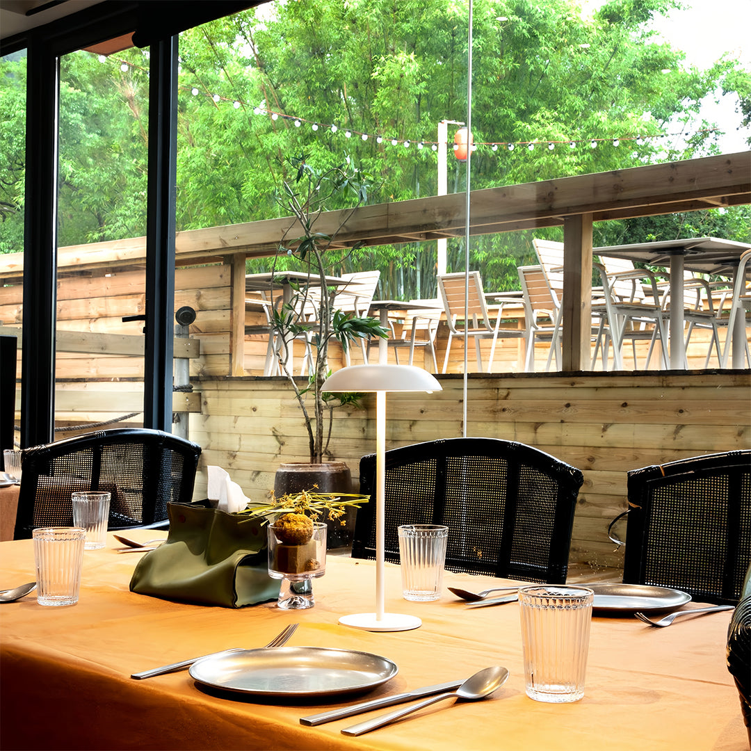 Outdoor patio space with small black pendant light creating intimate table lamp atmosphere