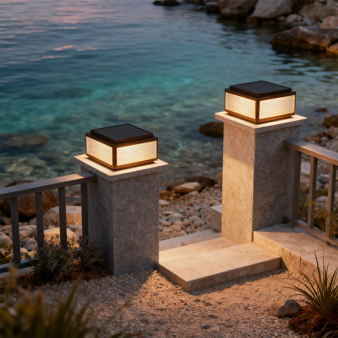 Outdoor patio pillar light along a patio with a sunset view, offering stylish and functional lighting.