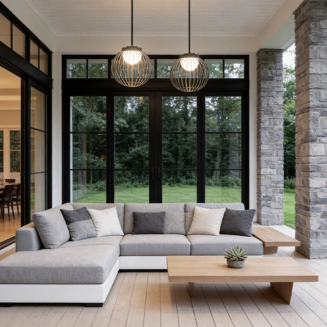 Outdoor pendant lighting modern with a sleek design, illuminating an indoor-outdoor living space.