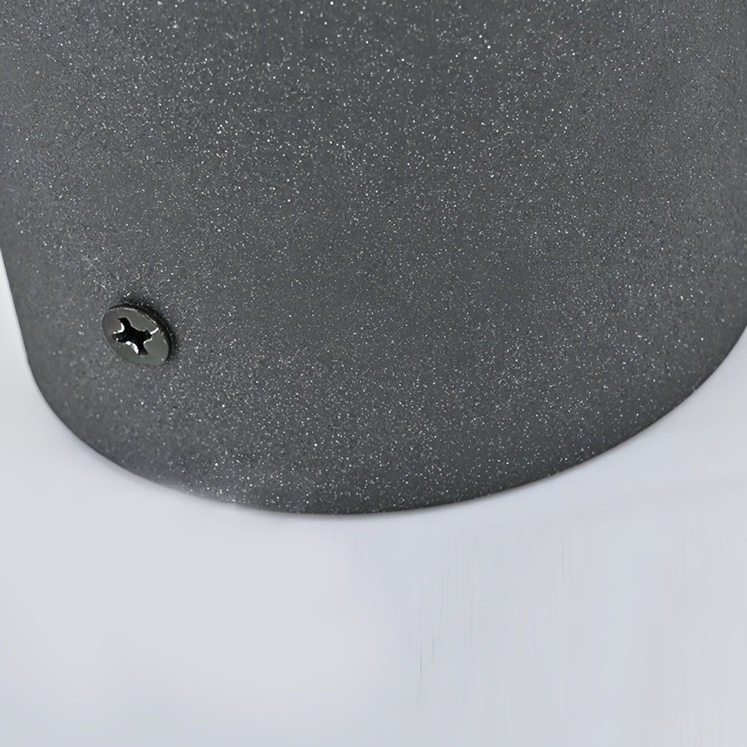 Textured metal base detail of a weather resistant outdoor pillar light.