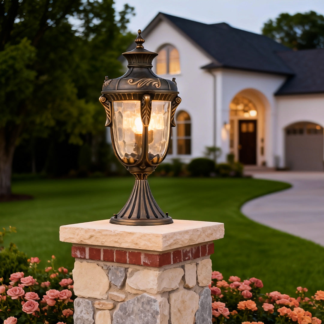 Outdoor pillar lights for house enhancing the curb appeal of a driveway with warm lighting.