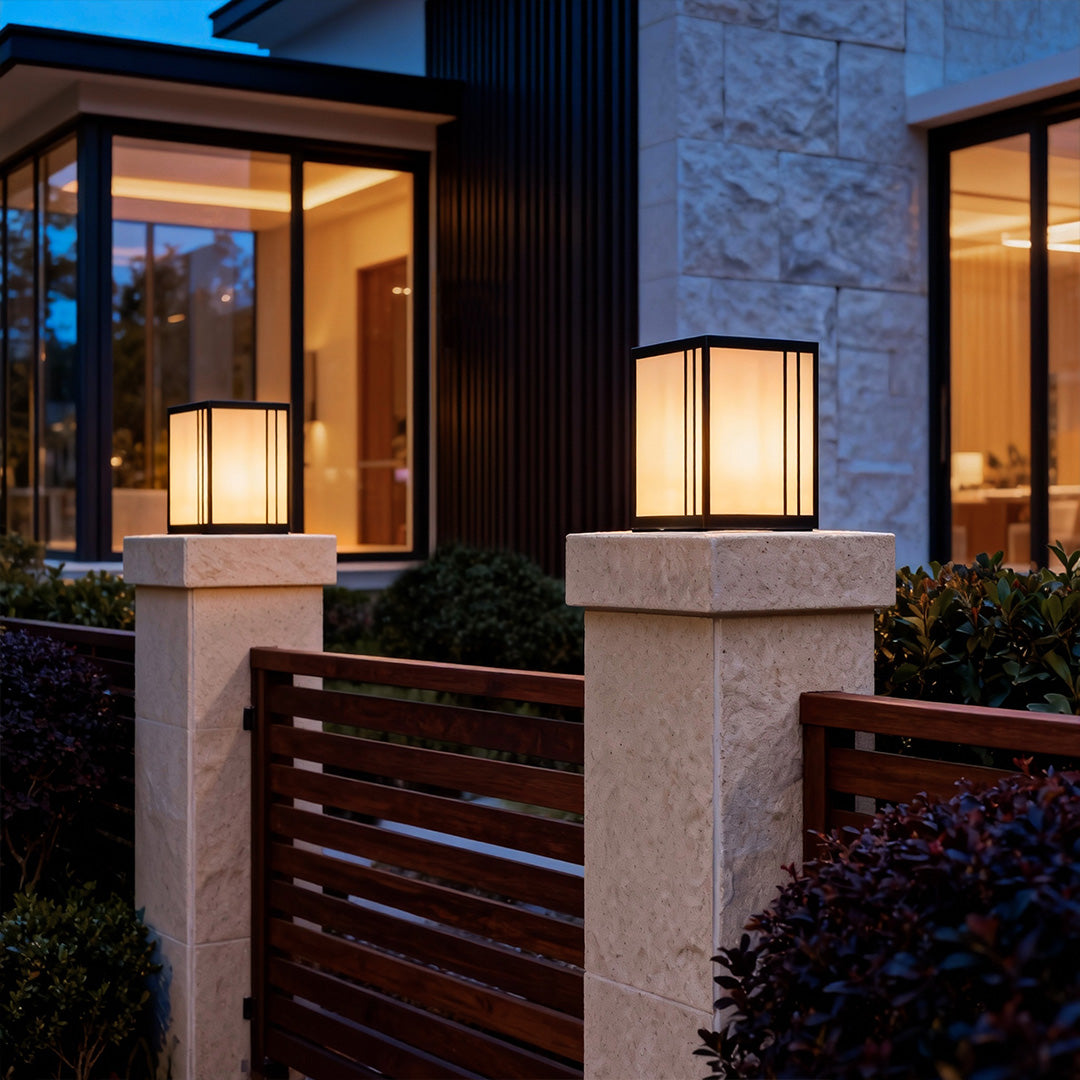 Outdoor pillar lights LED mounted on a concrete pillar, providing soft illumination for a wooden deck.