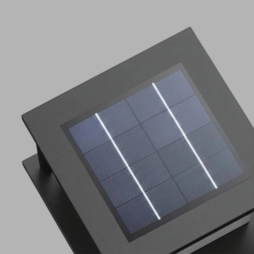 Close-up of outdoor pillar solar lights showing the integrated solar panel on the top surface.