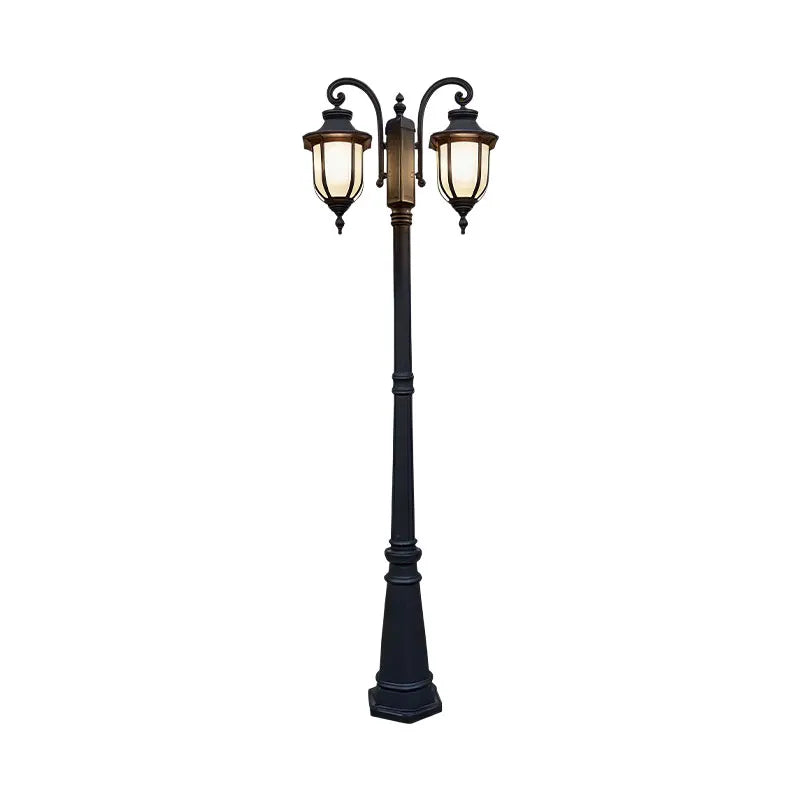 Outdoor post light fixture in a product view with two lantern heads and a black pole base.