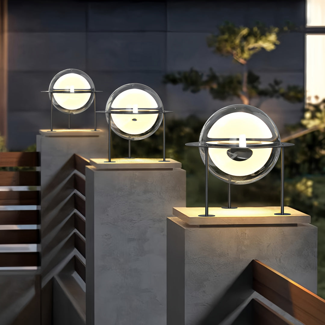 Outdoor scene showcasing modern circular main gate pillar light design mounted on tall exterior pillars.