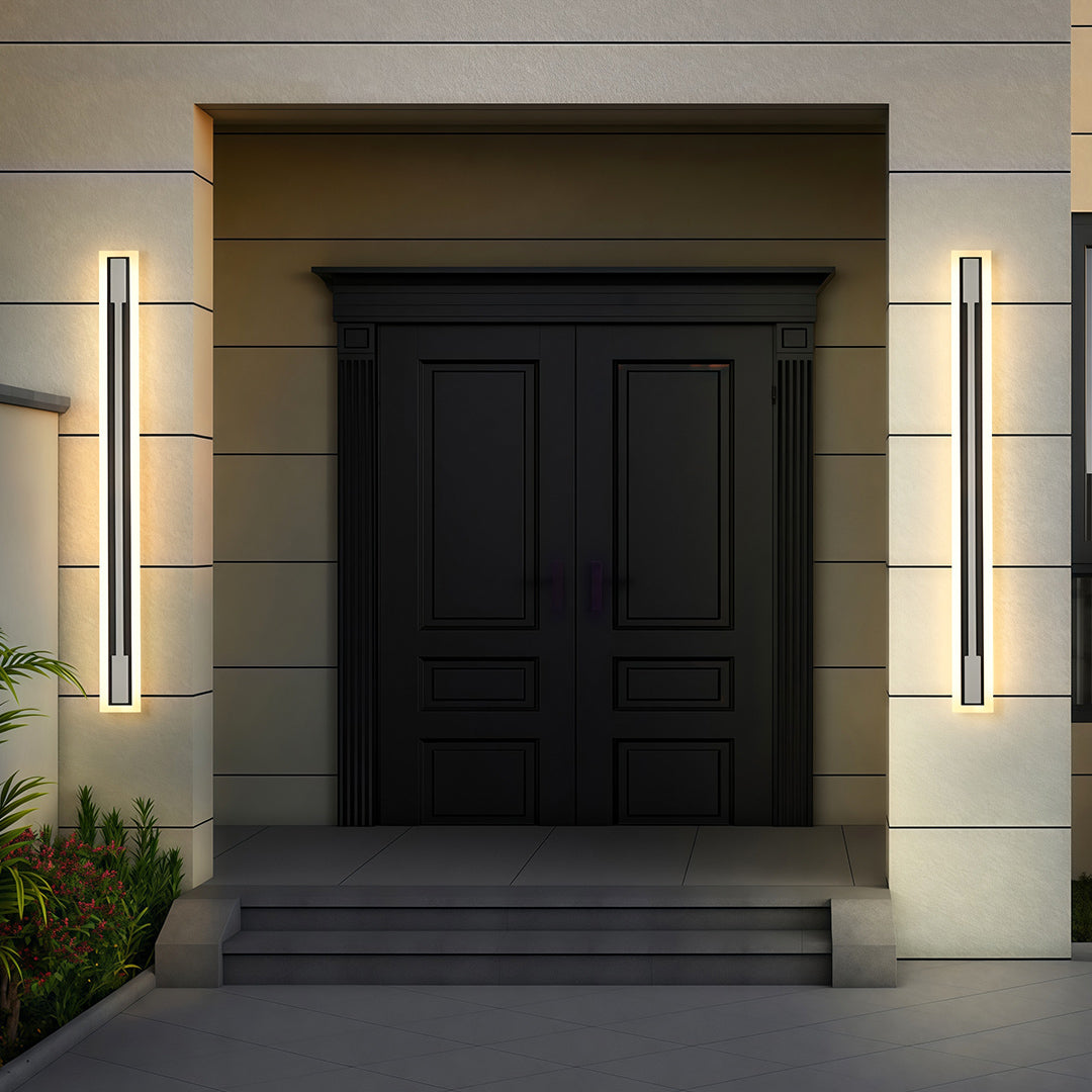 Outdoor light fixtures sconces providing ambient lighting along contemporary exterior walkway