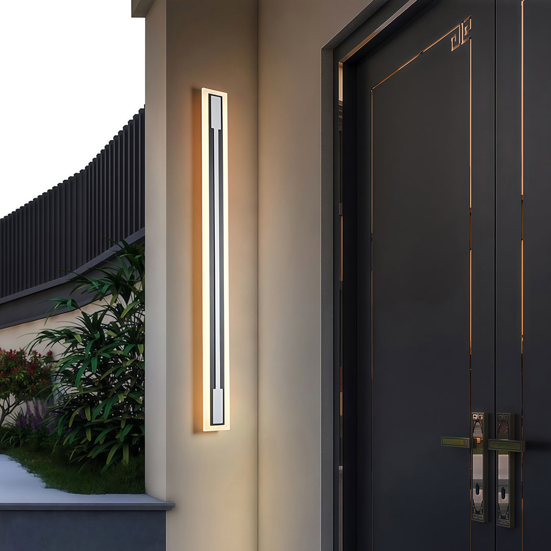Outdoor light fixtures sconces providing ambient lighting along contemporary exterior walkway