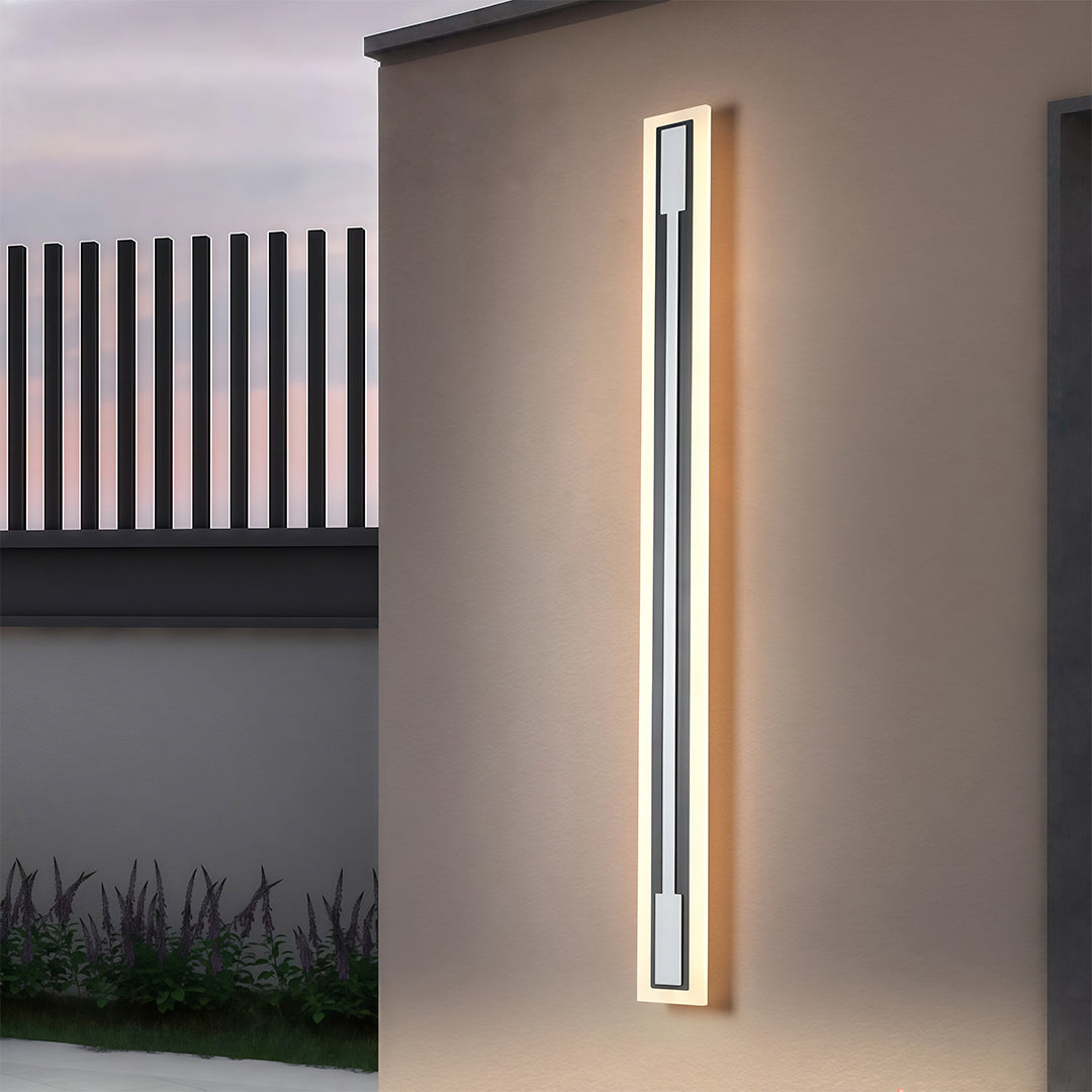 Outdoor light fixtures sconces providing ambient lighting along contemporary exterior walkway