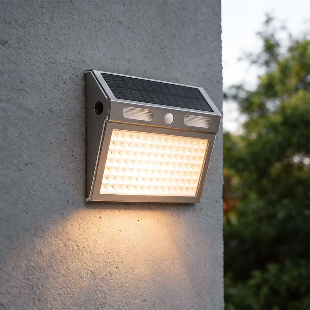 Outdoor solar wall light with motion sensor illuminating a modern house exterior with bright, secure glow.