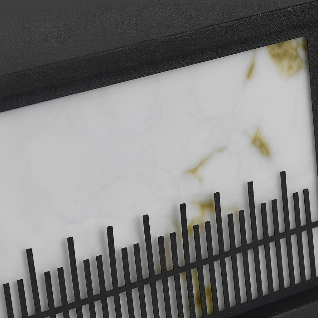 Outdoor stone pillar lights with a black frame, adding a modern touch to the garden.