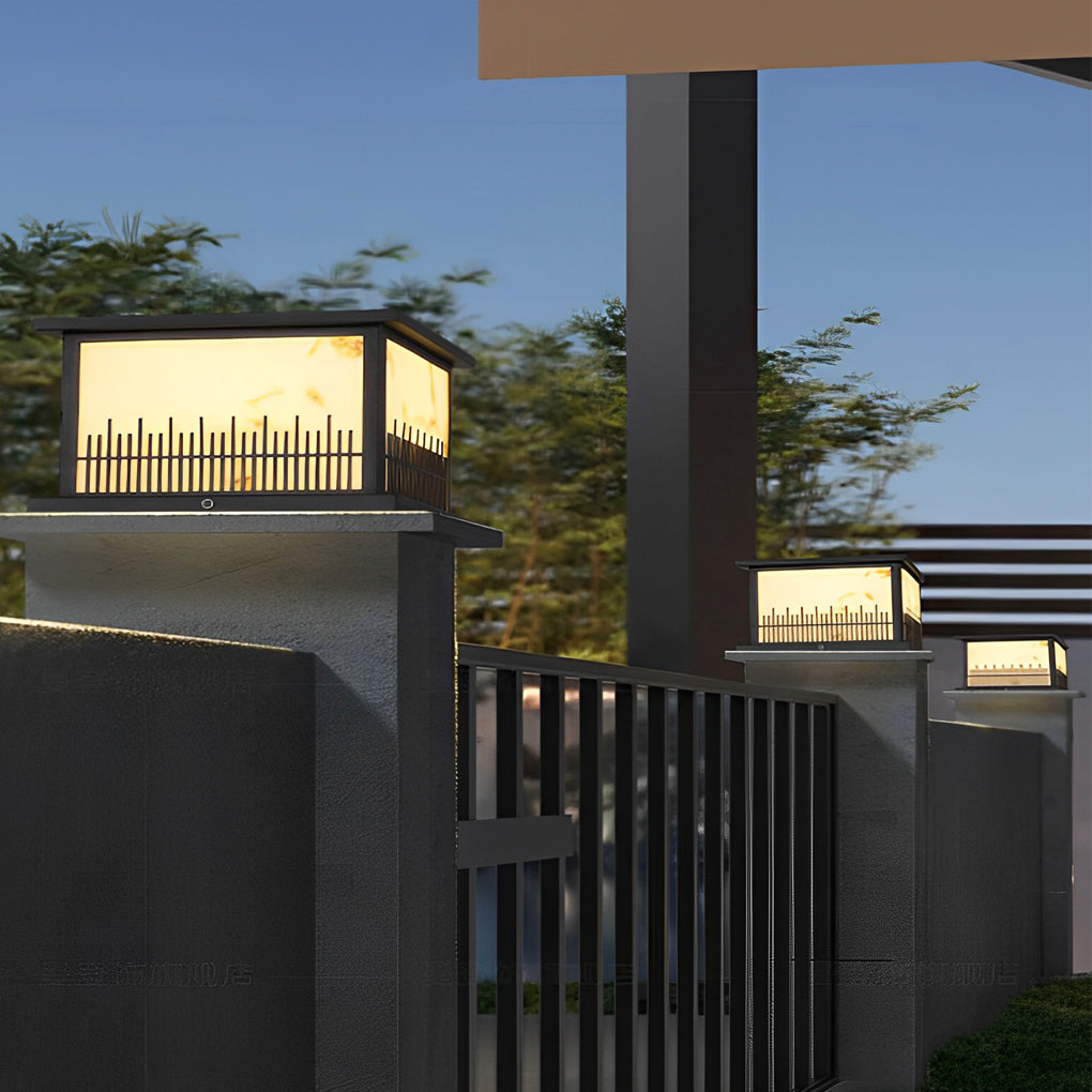 Outdoor stone pillar lights with a marble-like finish, enhancing the elegance of a modern exterior.