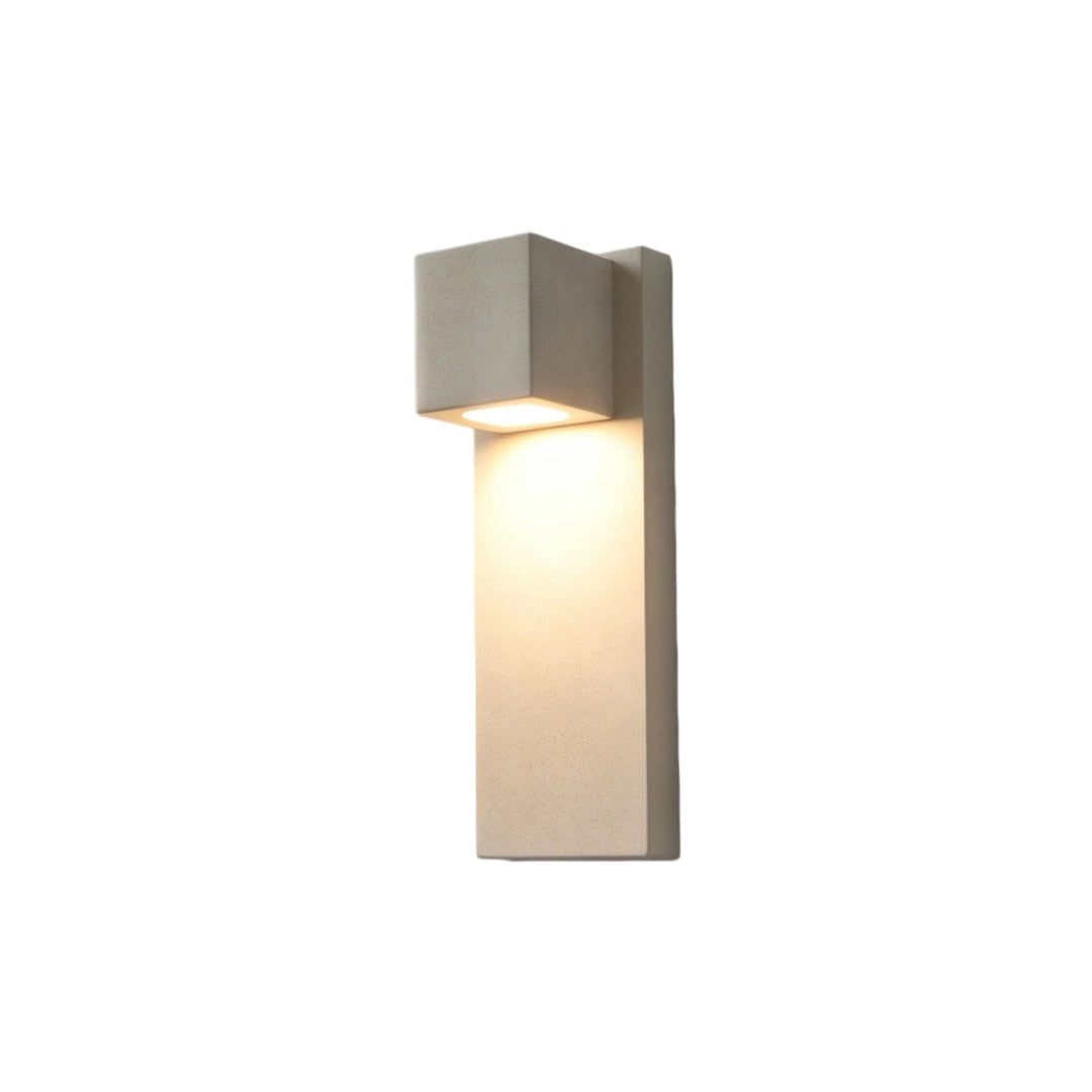 Outdoor stone wall lighting in a light beige stone finish isolated on a white background.
