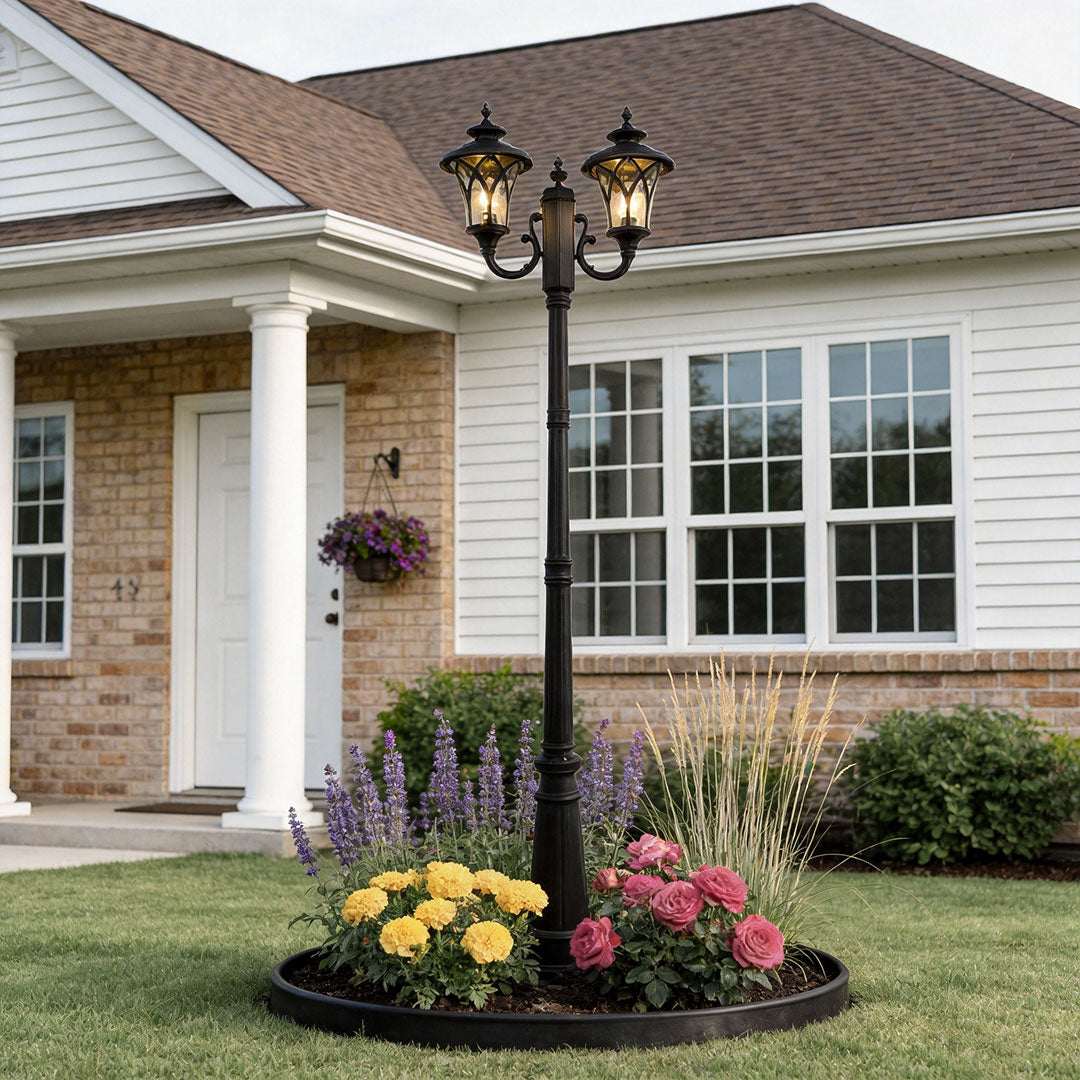 Outdoor street light with a classic design, illuminating a modern house entrance and garden.