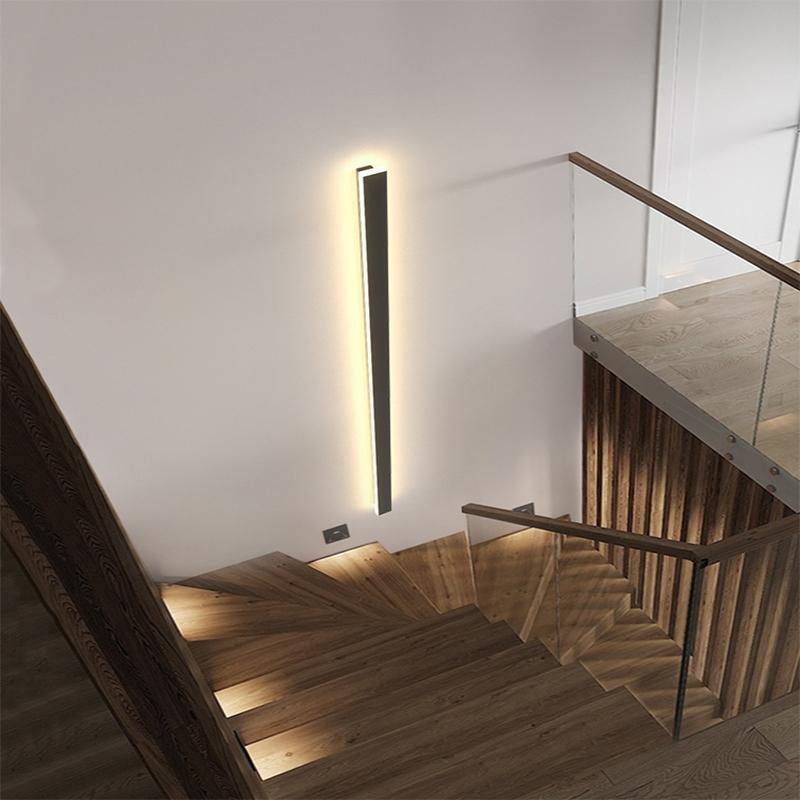 Outdoor strip wall light providing warm light along a staircase.