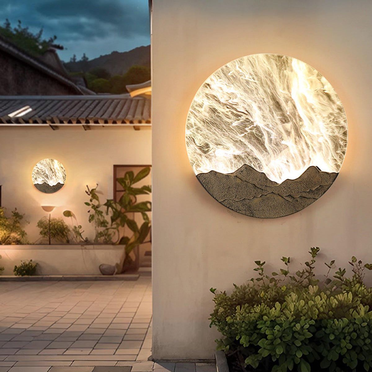 Outdoor terrace setting with circular decorative wall light providing atmospheric evening illumination