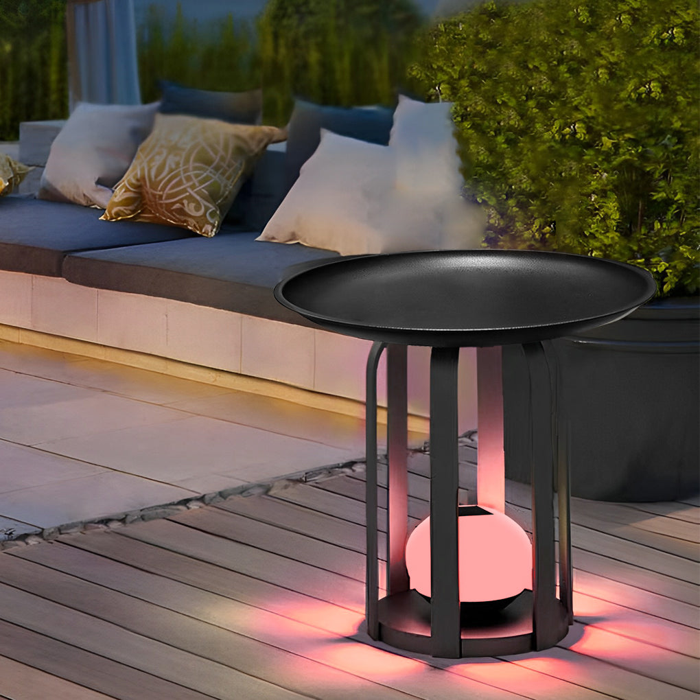 Outdoor tray floor lamp with a black finish, enhancing a contemporary outdoor lounge.