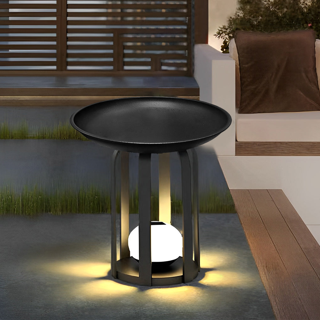 Outdoor tray floor lamp with a close-up of its tray and warm light.