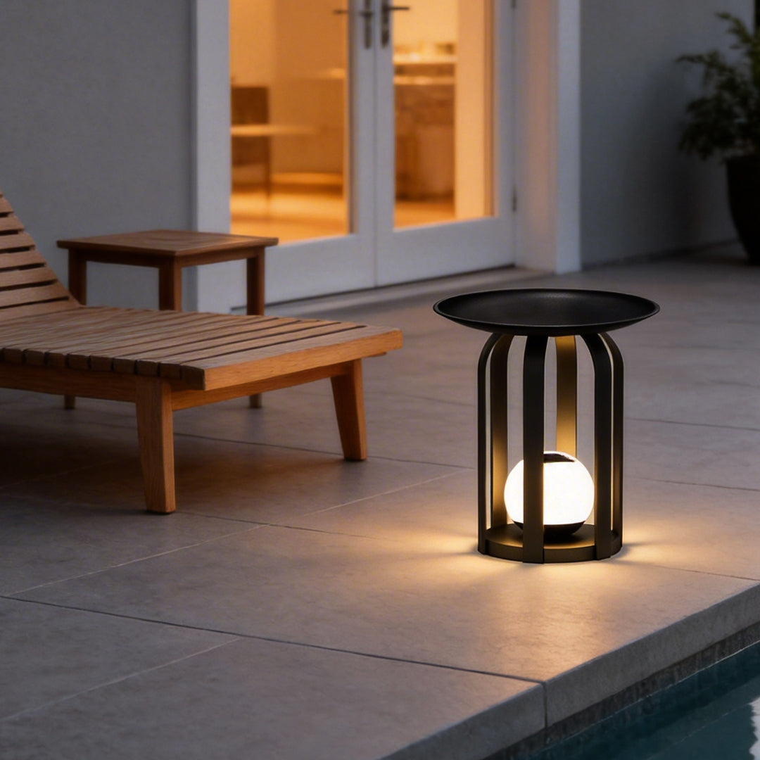 Outdoor tray floor lamp with a sleek design, illuminating a modern patio seating area.