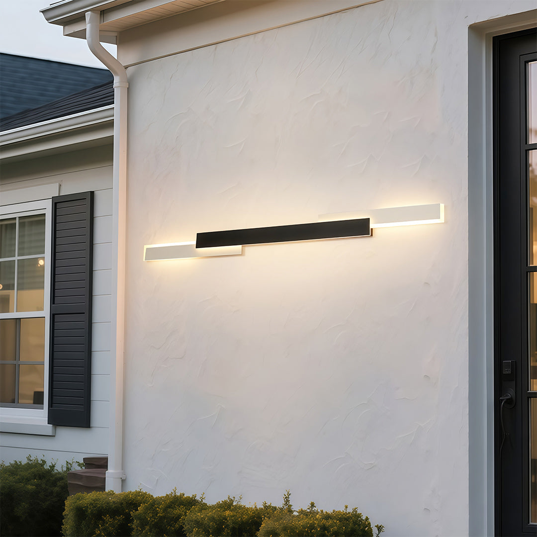 Outdoor light fixtures wall mount providing ambient lighting on modern white facade