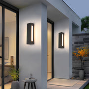 Modern luxury chandeliers inspired outdoor wall mount lights beside greenery in evening setting