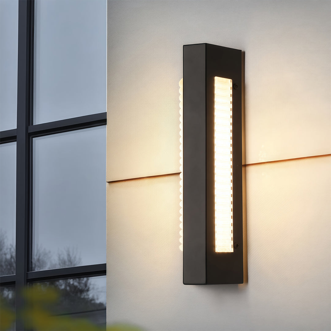 Modern luxury chandeliers inspired outdoor wall mount lights beside greenery in evening setting