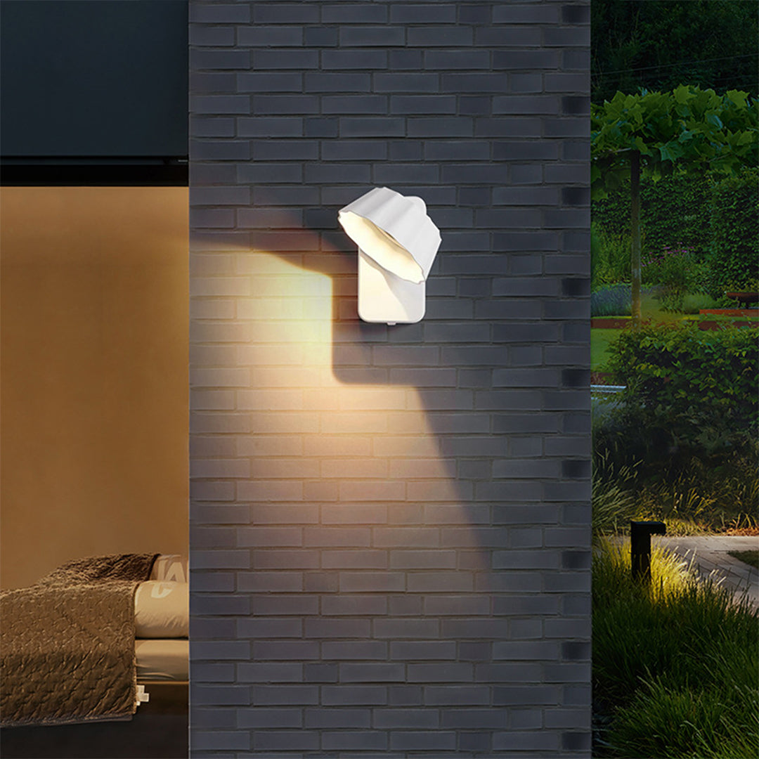 Outdoor wall light installation on modern house exterior with warm lighting at evening