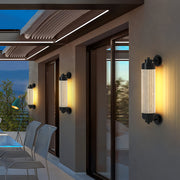 Outdoor wall lighting LED sconces mounted on a contemporary home entrance with warm ambient glow.